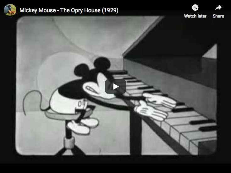 Misckey is trying to play Rachmaninov and Liszt in a 1929 cartoon, the first one with Mickey's gloves.