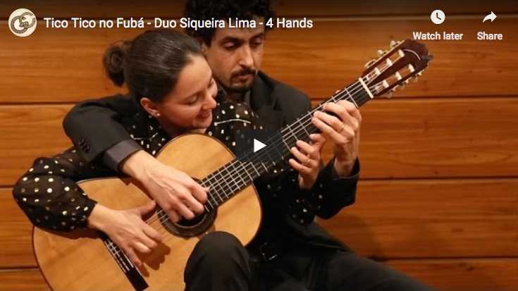 The Siqueira Lima Duo is playing Tico-Tico no Fubá at four hands on a guitar